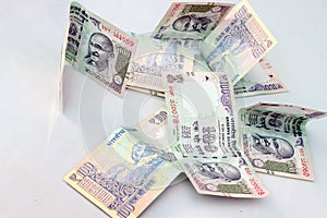 Indian currency of 100 rupee notes.