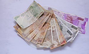 Indian currency bank notes of 5 and 10, 20, 500, 2000 rupees on white background with space for text