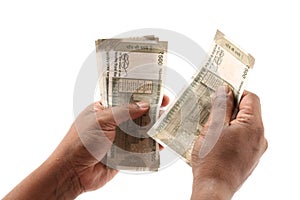 Indian currency notes and toy car in the hands bank loan concept