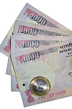 Indian currency rupee notes of value 1000 and coin