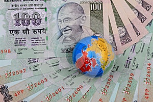 Indian Currency Rupees with a Globe photo