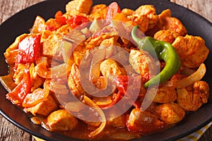 Indian curry Chicken Jalfrezi with spices, tomato sauce and caps photo