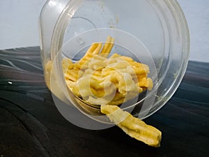 Indian deep fried snack gathia in plastic container