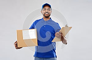 Indian delivery man with parcel box and clipboard