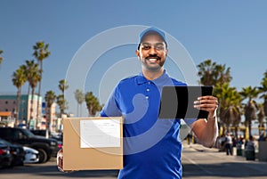 Indian delivery man with tablet pc and parcel box