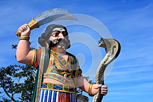 Indian demon statue with snake