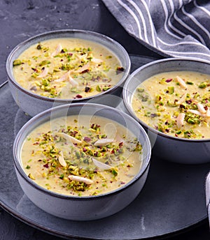 Indian dessert- kesar pista basundi in blue gray pottery