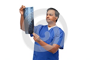 indian doctor or male nurse with x-ray