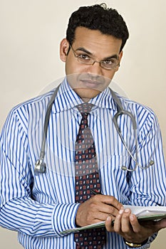 Indian doctor writing prescription