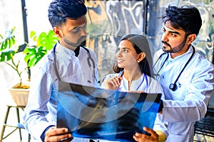 indian doctors are checking examining chest x-ray film