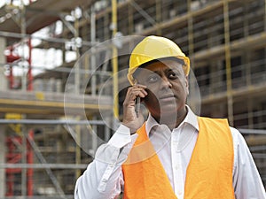 Indian engineer listening to worrying news on phone