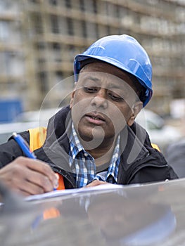 Indian engineer signing contracts or reports