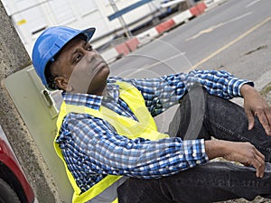 Indian engineer sitting tired