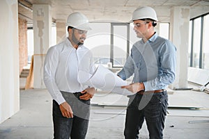 Indian and European construction workers together at a construction site