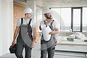 Indian and European construction workers together at a construction site