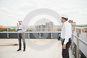 Indian and European construction workers together at a construction site
