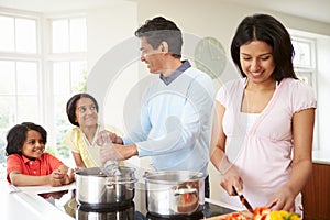 Indian Family Cooking Meal At Home