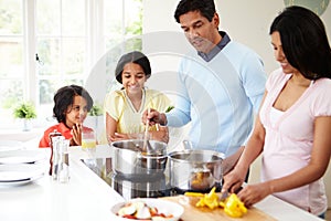 Indian Family Cooking Meal At Home