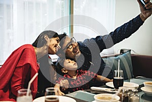 Indian Family out for meal in restaurant photo