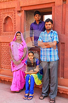 Indian family standing in Jahangiri Mahal in Agra Fort, Uttar Pr