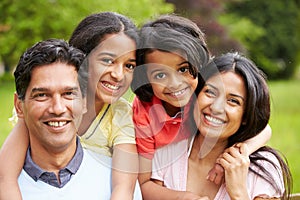 Indian Family Walking In Countryside