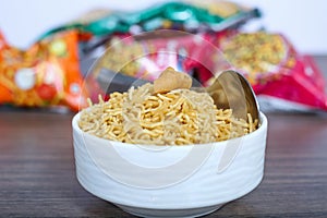 Indian famous fried and salted bikaneri namkeen bhujia in the bowl with spoon