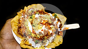 Indian famous Papdi Chaat Papri Chaat. A yummy snack assorted with crunchy base of Papdi crisp puris topped with lip-smacking