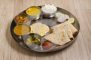 Indian Fasting cuisine Upwas items Thali complere meal for vrat ekadashi.Upawas thali meal with Rajgira puri, paratha,shakarkand