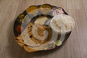 Indian Fasting cuisine Upwas items Thali complere meal for vrat ekadashi.Upawas thali meal with Rajgira puri, paratha,shakarkand