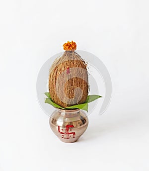 Indian festival akshaya tritiya concept : Decorative kalash with coconut and leaf with floral decoration