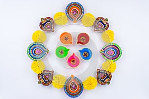 Indian festival Diwali, Diya oil lamps lit on colorful rangoli. Hindu traditional. Happy Deepavali. Copy space for text