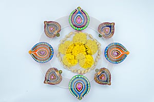 Indian festival Diwali, Diya oil lamps lit on colorful rangoli. Hindu traditional. Happy Deepavali. Copy space for text