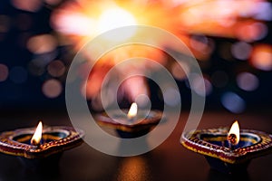 Indian festival Diwali, Diya oil lamps lit on colorful rangoli. Hindu traditional. Happy Deepavali. Copy space for text