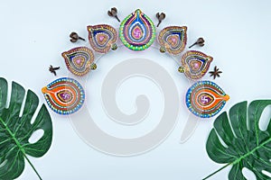 Indian festival Diwali, Diya oil lamps lit on colorful rangoli. Hindu traditional. Happy Deepavali. Copy space for text photo