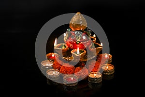 Indian Festival Diwali , oil lamp and flower design on dark background