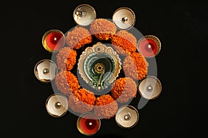 Indian Festival Diwali , oil lamp and flower design on dark background