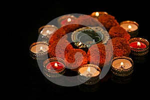 Indian Festival Diwali , oil lamp and flower design on dark background