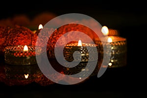 Indian Festival Diwali , oil lamp and flower design on dark background