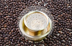 Indian filter coffee in a brass cup