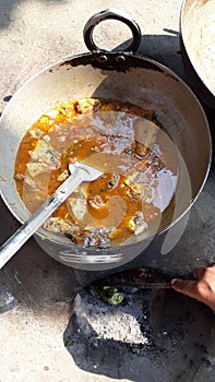 Indian fish curry in outdoor cooking photo