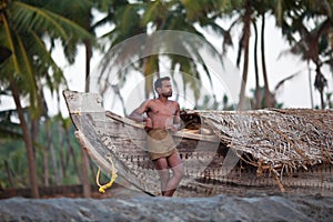 Indian fisherman and the wooden boat