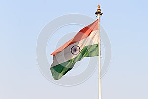 Indian flag flying against blue sky background. The National Flag of India is a horizontal rectangular tricolor saffron, white