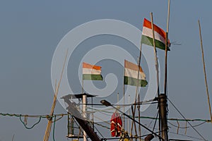 Indian flags on the masts of a fishing boat.