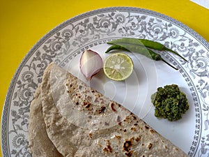 Indian flat bread served with green chilli chutney traditionally called as Theccha in Marathi