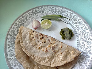Indian flat bread served with green chilli chutney traditionally called as Theccha in Marathi