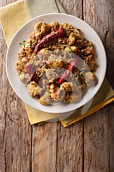 Indian food: Chettinad chicken curry with chili pepper closeup.