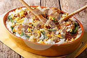 Indian food: chicken dum biryani close-up in a dish. horizontal