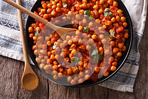 Indian Food: chickpeas in curry sauce close-up. Horizontal top v