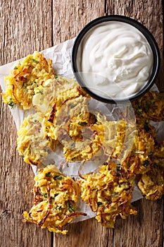 Indian food: crispy fried onion Bhajis close-up. vertical top vi