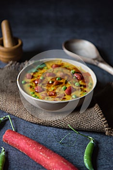 Indian food dal tadka or lentil soup served in a bowl.